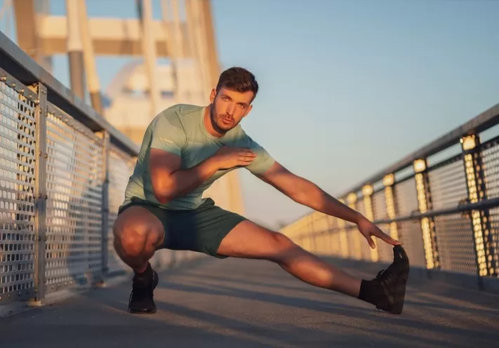 how to maximize your exercise high - man stretching