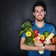 feel-good whole-food nutrition - a man holding healthy fruits